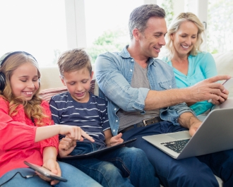 family using electronics devices